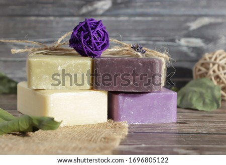 soap of light shades from natural ingredients on a wooden surface Royalty-Free Stock Photo #1696805122
