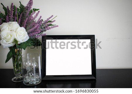 Empty frame with flowers, insert your own photo