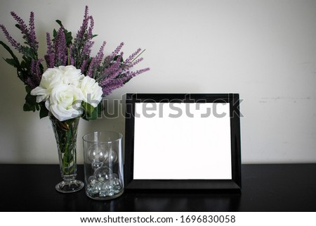 Empty frame with flowers, insert your own photo