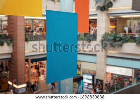 Clean, empty banners hanged inside the shopping mall. Brand promotion, mockup