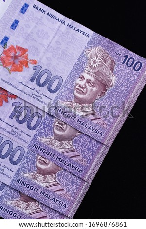 Malaysia currency of Malaysian ringgit banknotes background. Paper money of hundred ringgit notes on etreme closeup. Financial concept.