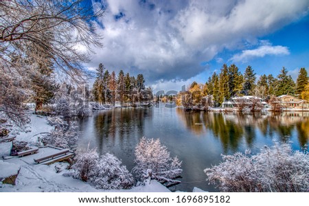 Winter view of Mirror Pond on Deschutes River from Drake Park in Bend, Oregon Royalty-Free Stock Photo #1696895182