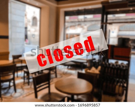 A warning sign that  restaurants or cafe are closed.