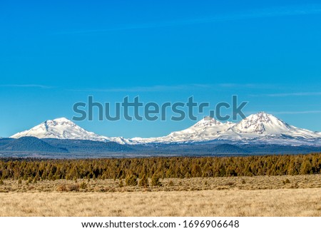 Telephoto view of Three Sisters Peaks near Sisters, Oregon Royalty-Free Stock Photo #1696906648