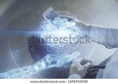 Double exposure of man's hand holding and using a digital device and data theme drawing. Technology concept.