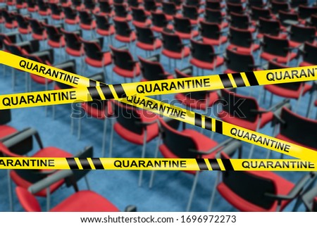 Empty concert hall. Concept - cancellation of an event due to quarantine. Inscription quarantine on the background of empty chairs. Yellow ribbon with the word quarantine.  Transferring due to fever