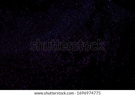 Black background photos The sparkling stars in the sky resemble a galaxy.