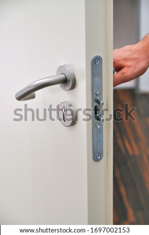 Emergency exit door, lock system and door handle detail