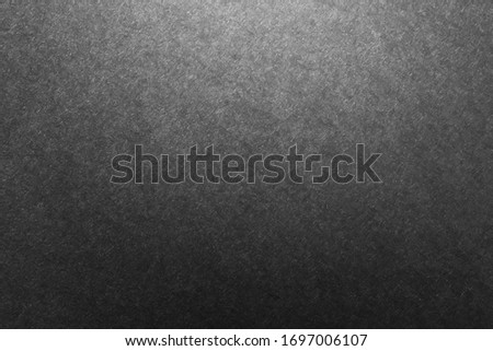 Black paper texture for background.