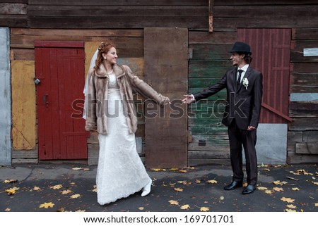 Image of groom and bride outdoors