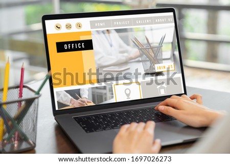 business woman using website on digital laptop on desk.