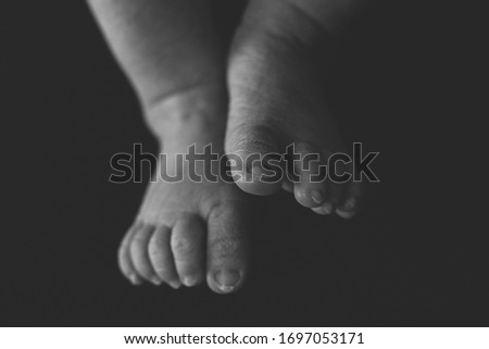 Dark picture of baby feet