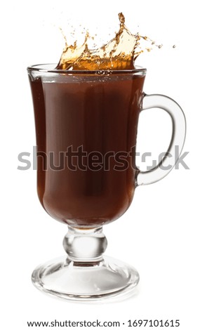 Splashing of coffee in glass cup on white background