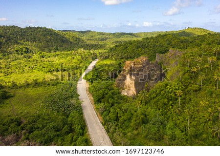 Jungle road on a tropical island. Royalty-Free Stock Photo #1697123746