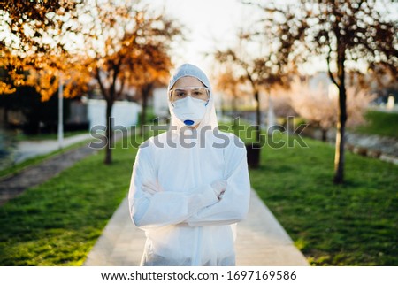 Disinfection service worker in hazmat suit with N95 mask and protective glasses.Private protective equipment (PPE).Quarantined area decontamination.Protective clothing. COVID-19 corona virus doctor Royalty-Free Stock Photo #1697169586