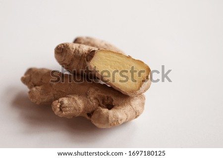  Ginger root in the context of close-up on a white background. Immune support during an epidemic, self-treatment
