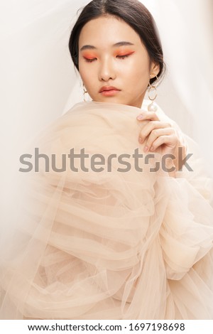 Woman transparent fabric charm makeup model
