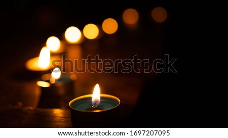 many candles in the dark Royalty-Free Stock Photo #1697207095