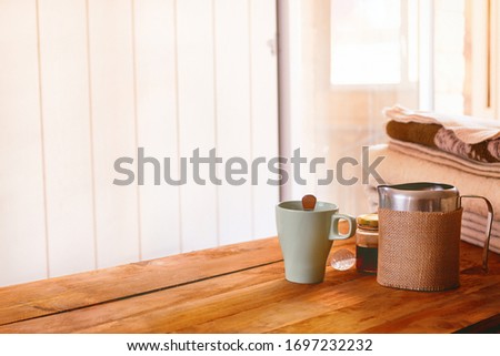 Breakfast in bed with unique touches that turn a house into a home, with a cup of milk and honey.