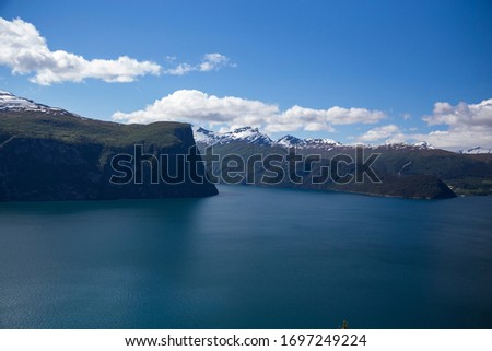 Beautiful Norwegian fjord during the summer, blue water, mountains.