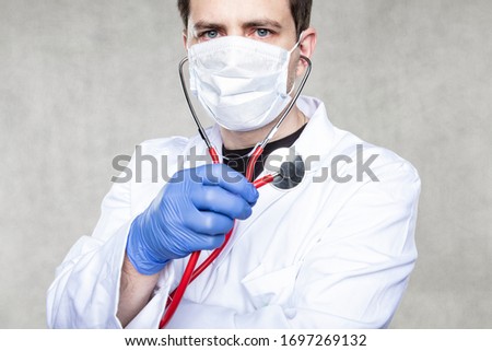 doctor with stethoscope, portrait of a busy professional