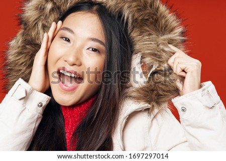 Cheerful woman lifestyle winter jacket studio fun fashion