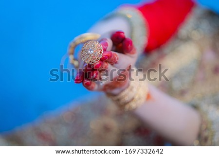 Bride hands with mehndi hina on wedding day. Beautiful hands with beautiful hina design. Beautiful bride hands picture.