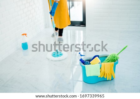 Young asian woman cleaning house Sweeping the floor with a mop House keeping concept Royalty-Free Stock Photo #1697339965