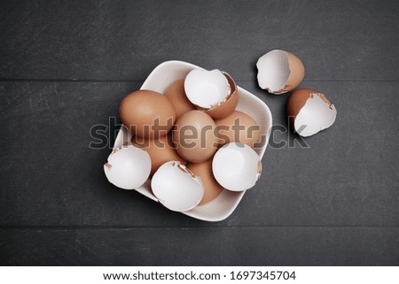 Top view of many eggs on the table for cooking. Baking ingredients on wooden table.
