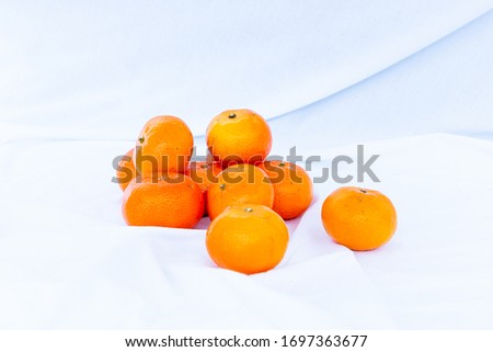orange tangerines on a white background