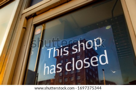 'This shop has closed' sign- one of many high street shops closing down due to bad economic climate Royalty-Free Stock Photo #1697375344