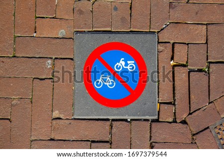 Bicycle sign on the sidewalk in Amsterdam