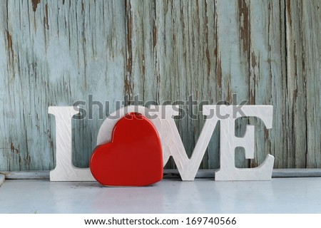 word love  made of white wooden letters on vintage background 