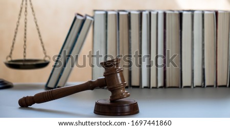 justice legal and jurisprudence concept. Law books on lawyer desk at law firm.
