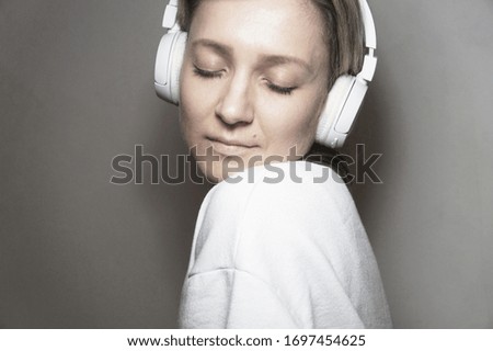 Portrait of young beautiful woman listening to music     