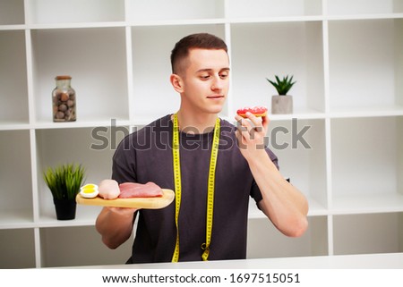 Trainer consumes a high-protein meal of meat and fruits.