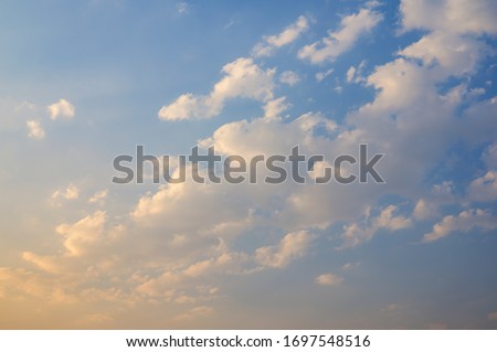 Background of a slightly cloudy sky and under a light veil of smoke in the late afternoon Royalty-Free Stock Photo #1697548516