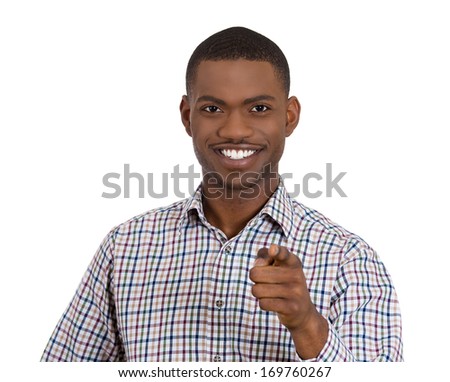 Closeup portrait of young smiling handsome man pointing at you camera gesture, isolated on white background. Positive human emotion facial expression feelings, signs and symbols