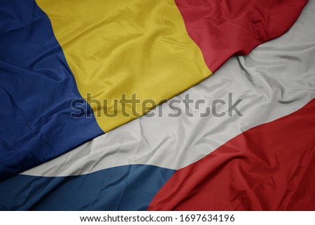 waving colorful flag of czech republic and national flag of romania. macro
