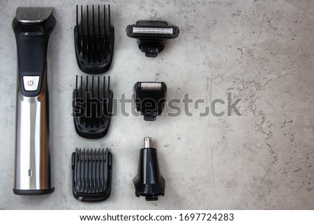 
Hair clipper. Barbershop. Hair clipper on gray background. Royalty-Free Stock Photo #1697724283