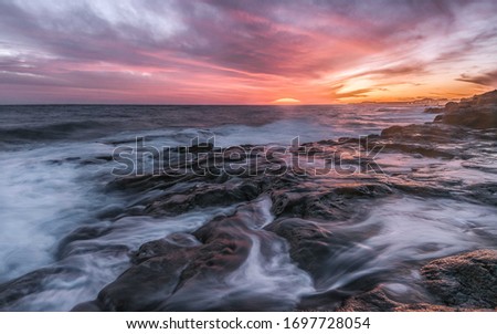 Rocky Beach with Sunlight and amazing waves