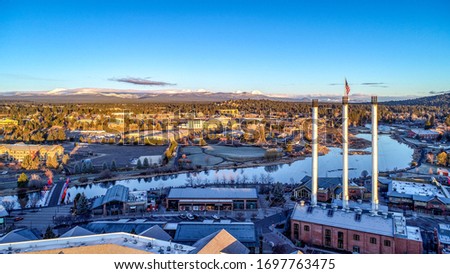 Old Mill Smoke Stacks aerial sunrise in Bend, Oregon Royalty-Free Stock Photo #1697763475