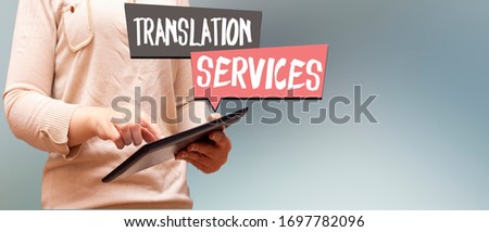 closeup woman holding tablet, speech bubbles with translation and services concept 