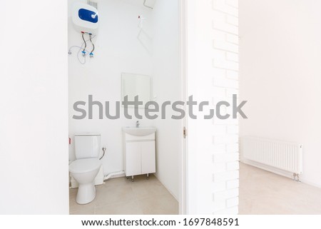 small toilet in a small office