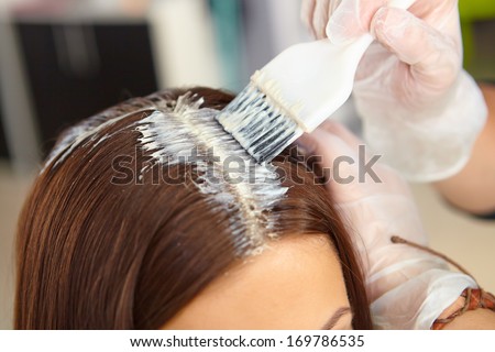 Hair salon. Application of cosmetics. Royalty-Free Stock Photo #169786535