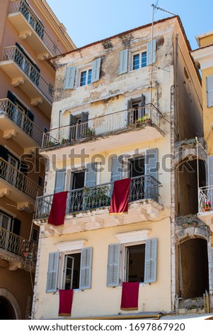 Traditional easter holidays in Corfu island, Greece. Windows and balconies at Liston Square in Kerkyra.
