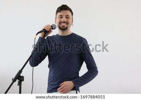 Handsome Young Man Singing, looking at the Camera 