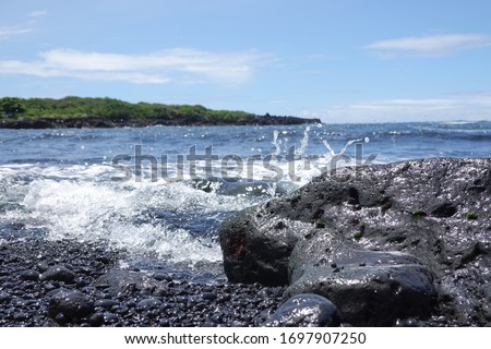 Closeup of the constituents of a volcanic black sand beach
