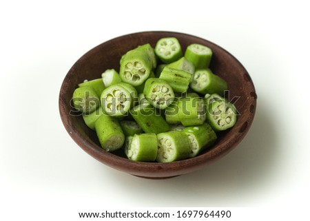 Sliced Okra. Also Know Quiabo over a white background