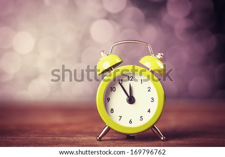 Retro alarm clock. Photo in retro color image style